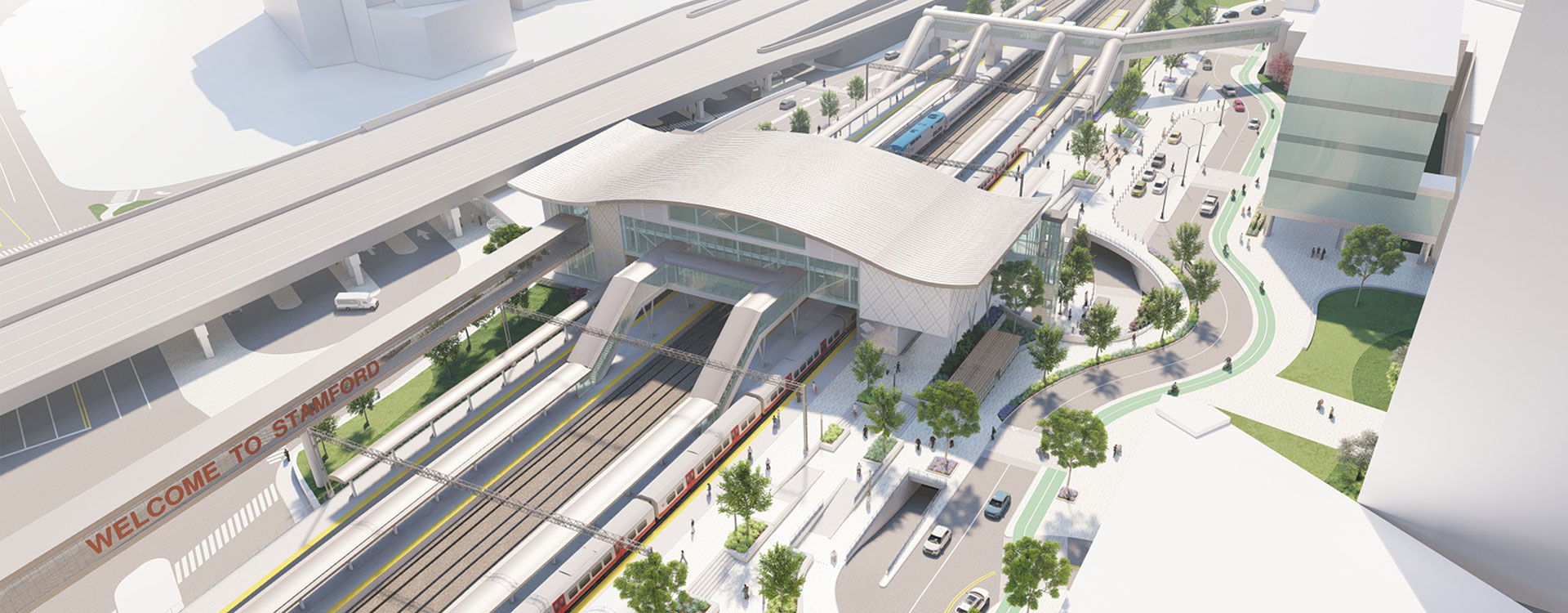 Oblique aerial view of rendered STC concept, parking garage, adjacent buildings, and highway with traveling cars and trucks.
